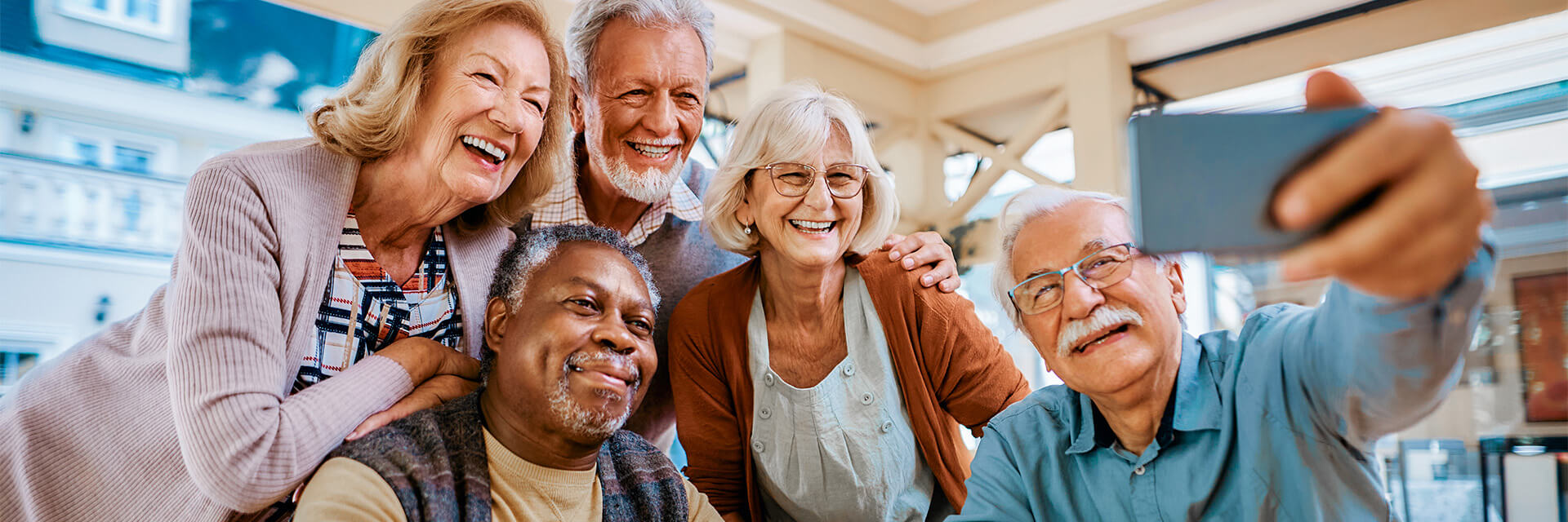 Group of senior adults taking a selfie.