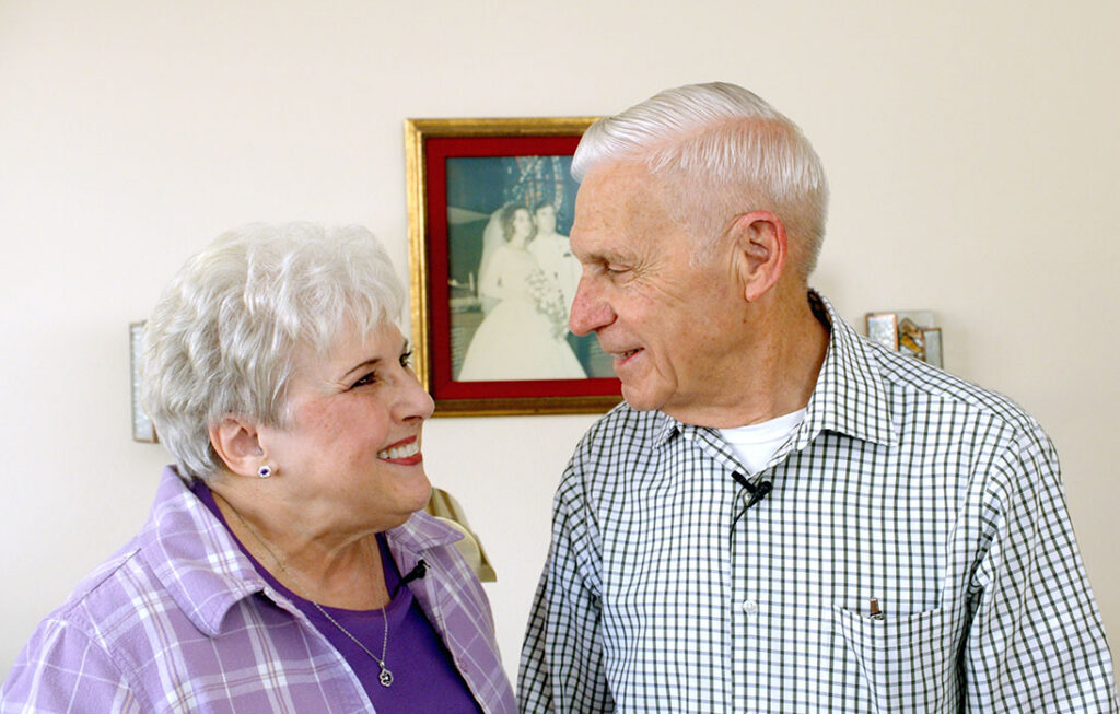 Terry and Diane smiling at each other.