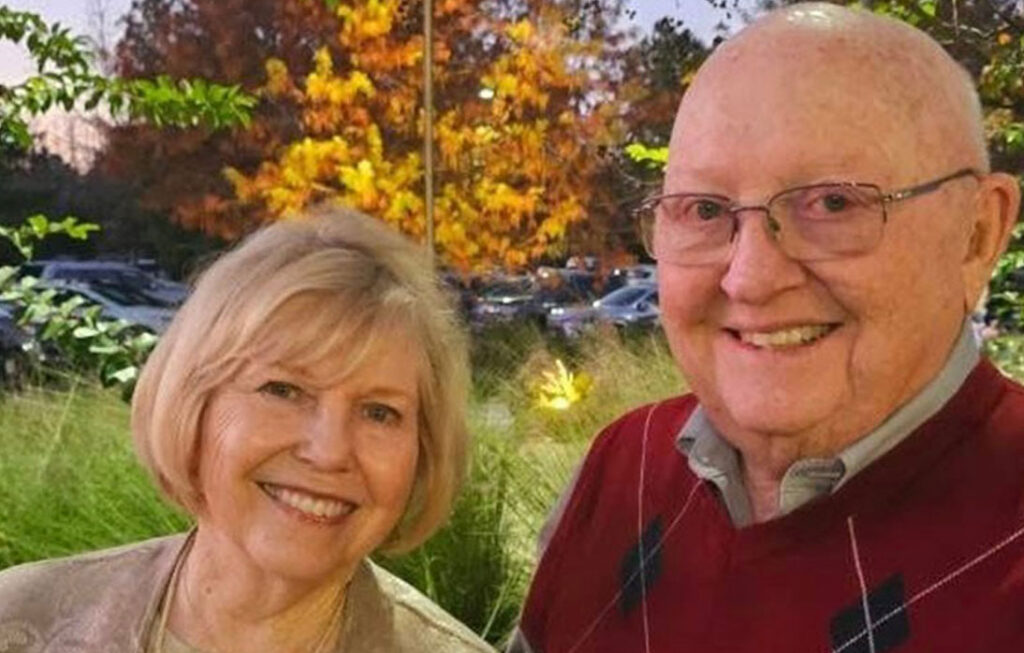 Jim and Mary Erkmann smiling outside.